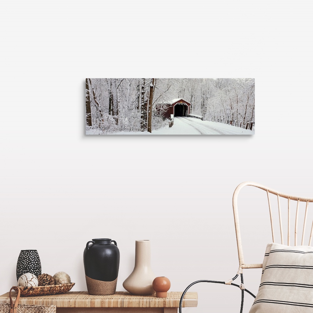 A farmhouse room featuring Panoramic photograph of a snow covered bridge in Pennsylvania that is surrounded by a forest.