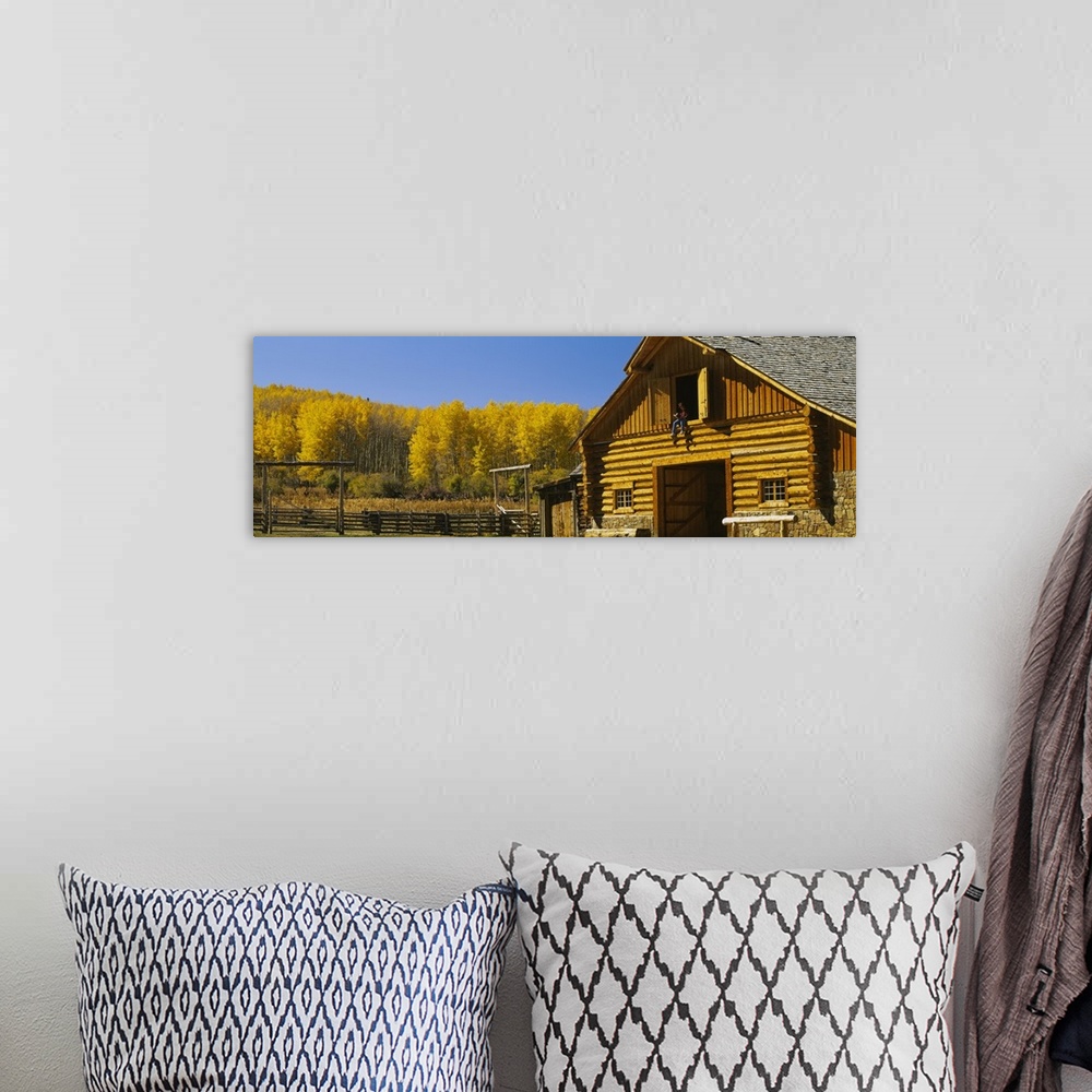 A bohemian room featuring Cowboy sitting on a window of a log cabin Ouray County Ridgeway Colorado