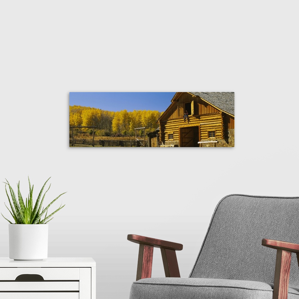 A modern room featuring Cowboy sitting on a window of a log cabin Ouray County Ridgeway Colorado