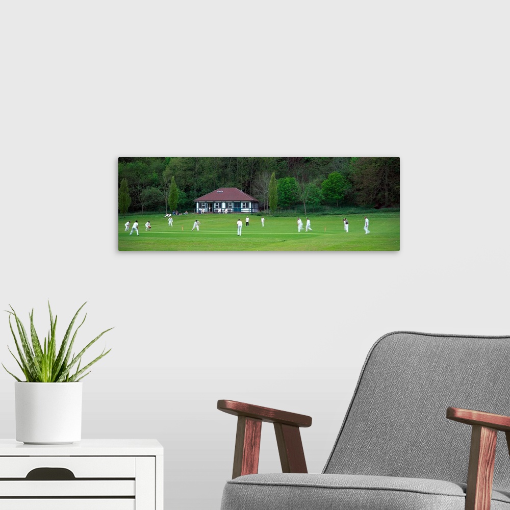 A modern room featuring Cricket match in progress Patcham Brighton East Sussex England