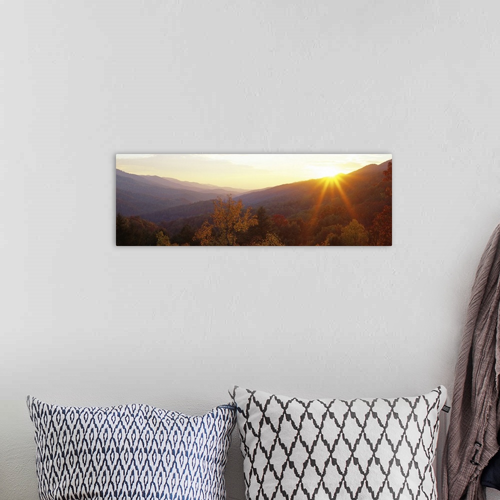 A bohemian room featuring This decorative wall art is a panoramic photograph of the Appalachian Mountains in Kentucky at su...