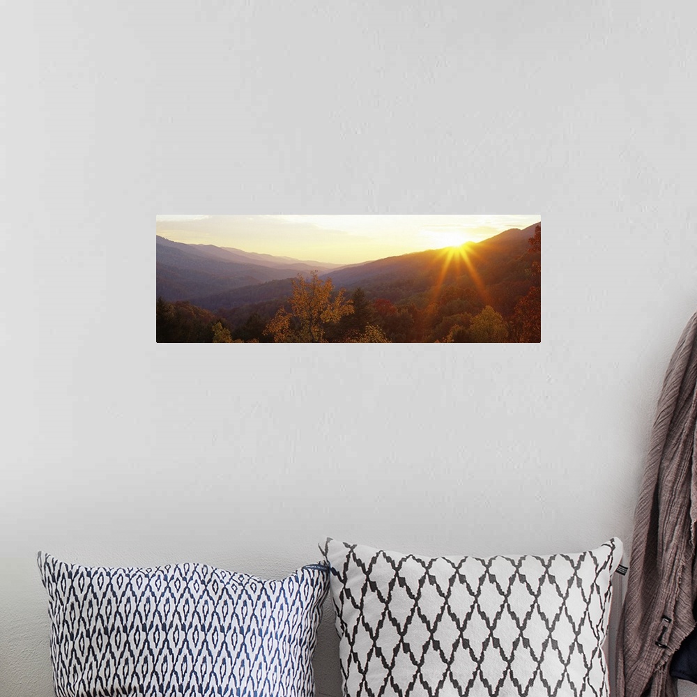 A bohemian room featuring This decorative wall art is a panoramic photograph of the Appalachian Mountains in Kentucky at su...