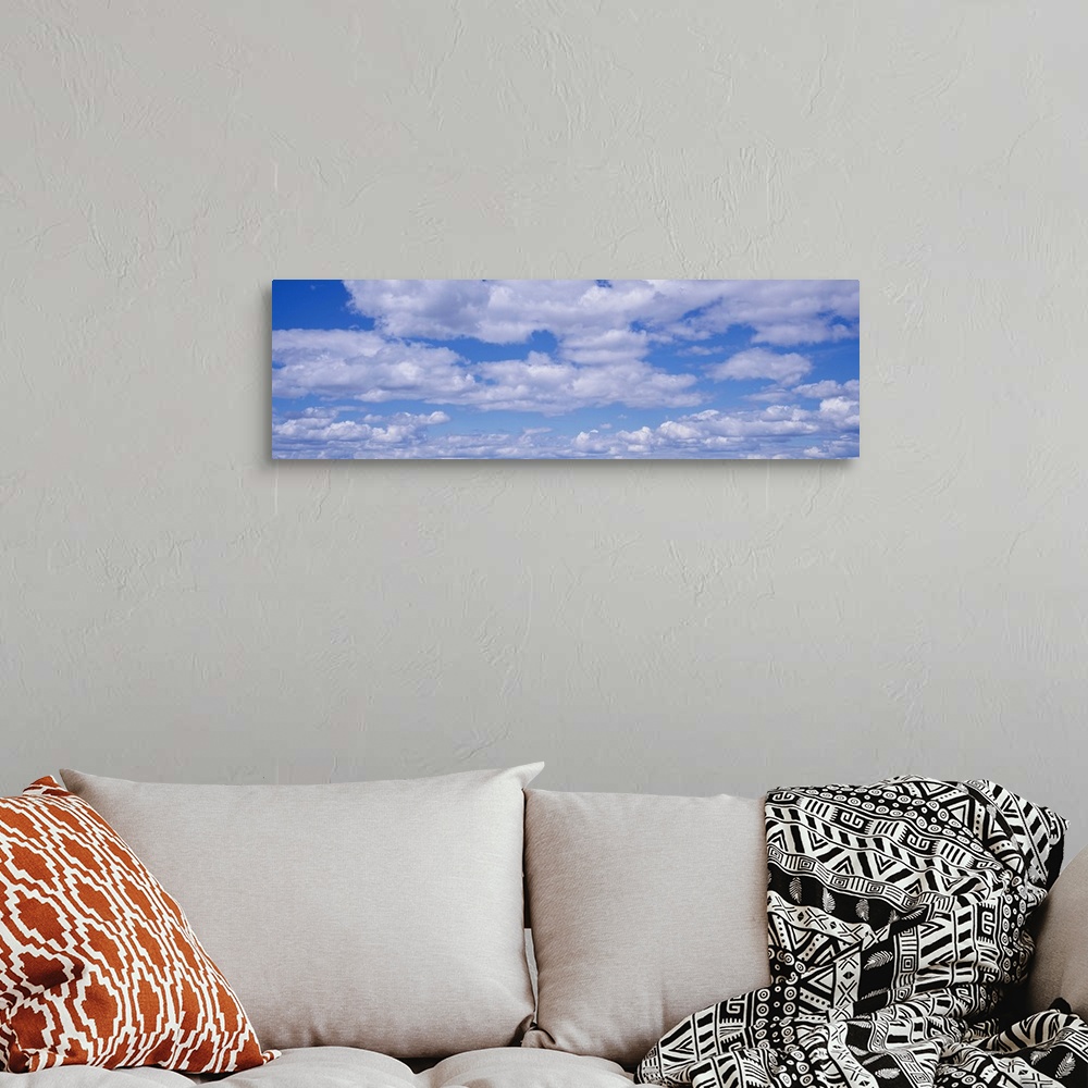 A bohemian room featuring Cumulus Clouds Blue Sky