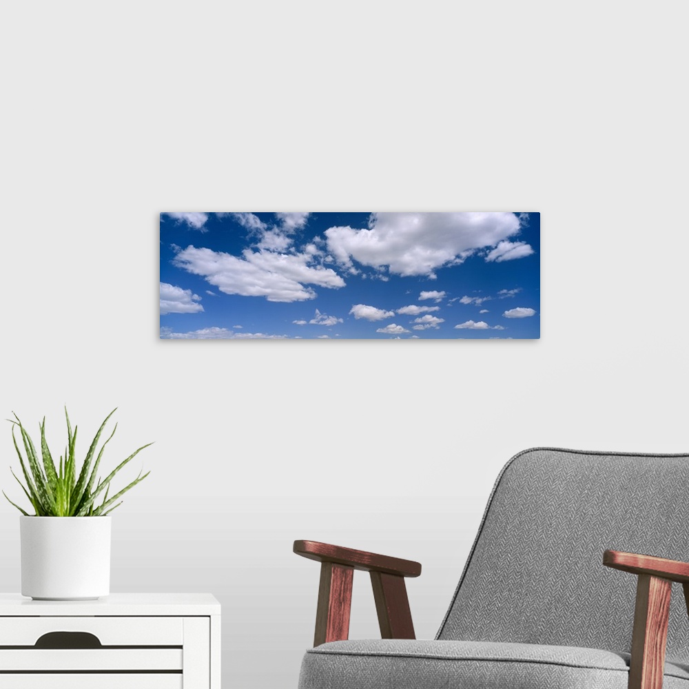 A modern room featuring Cumulus clouds in the sky