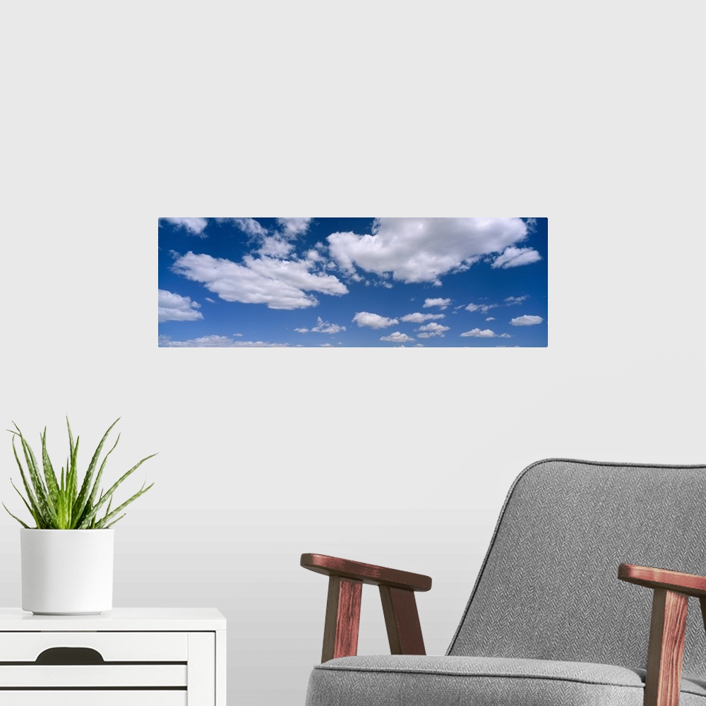 A modern room featuring Cumulus clouds in the sky