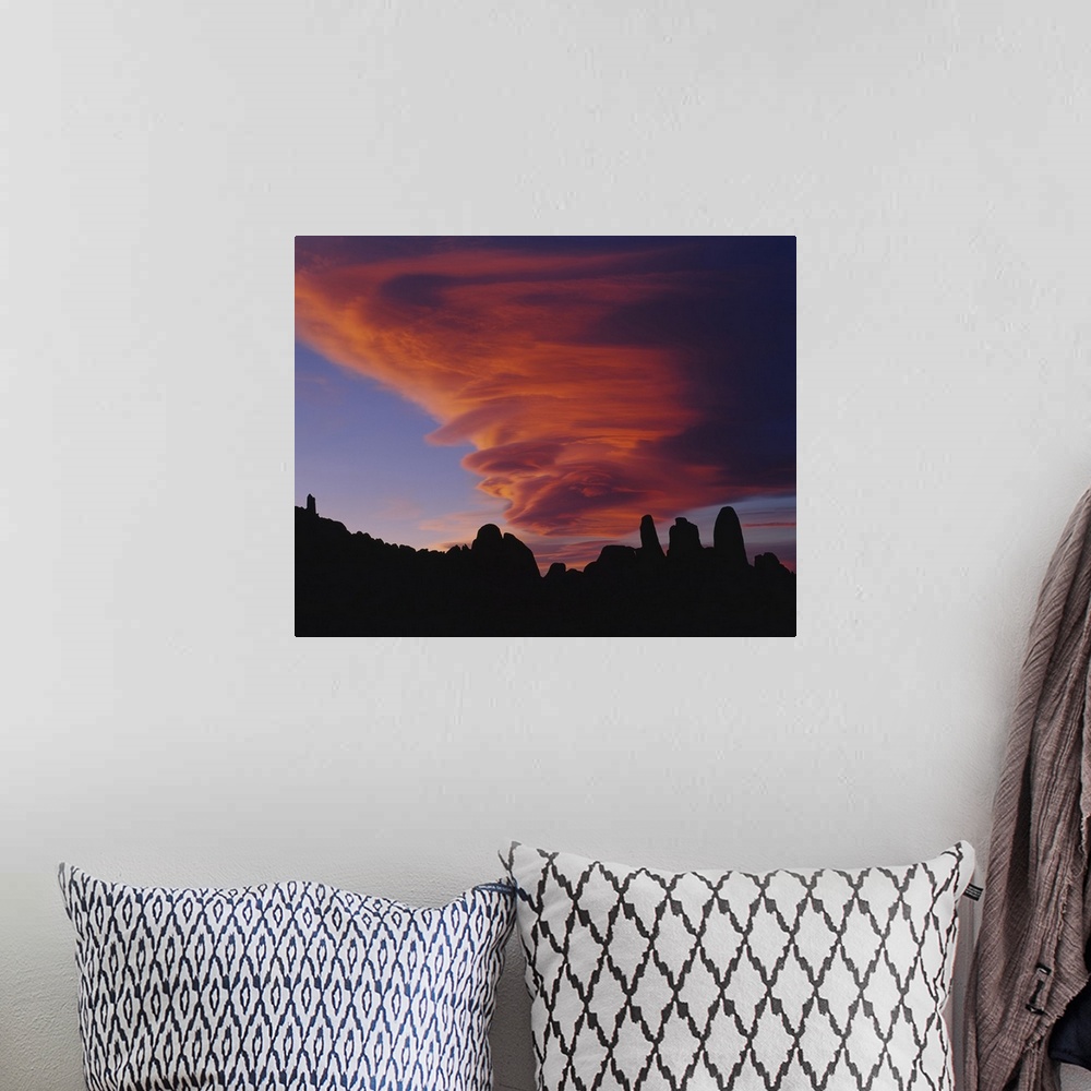 A bohemian room featuring Cyclone shaped clouds over rocks, Californian Sierra Nevada, California
