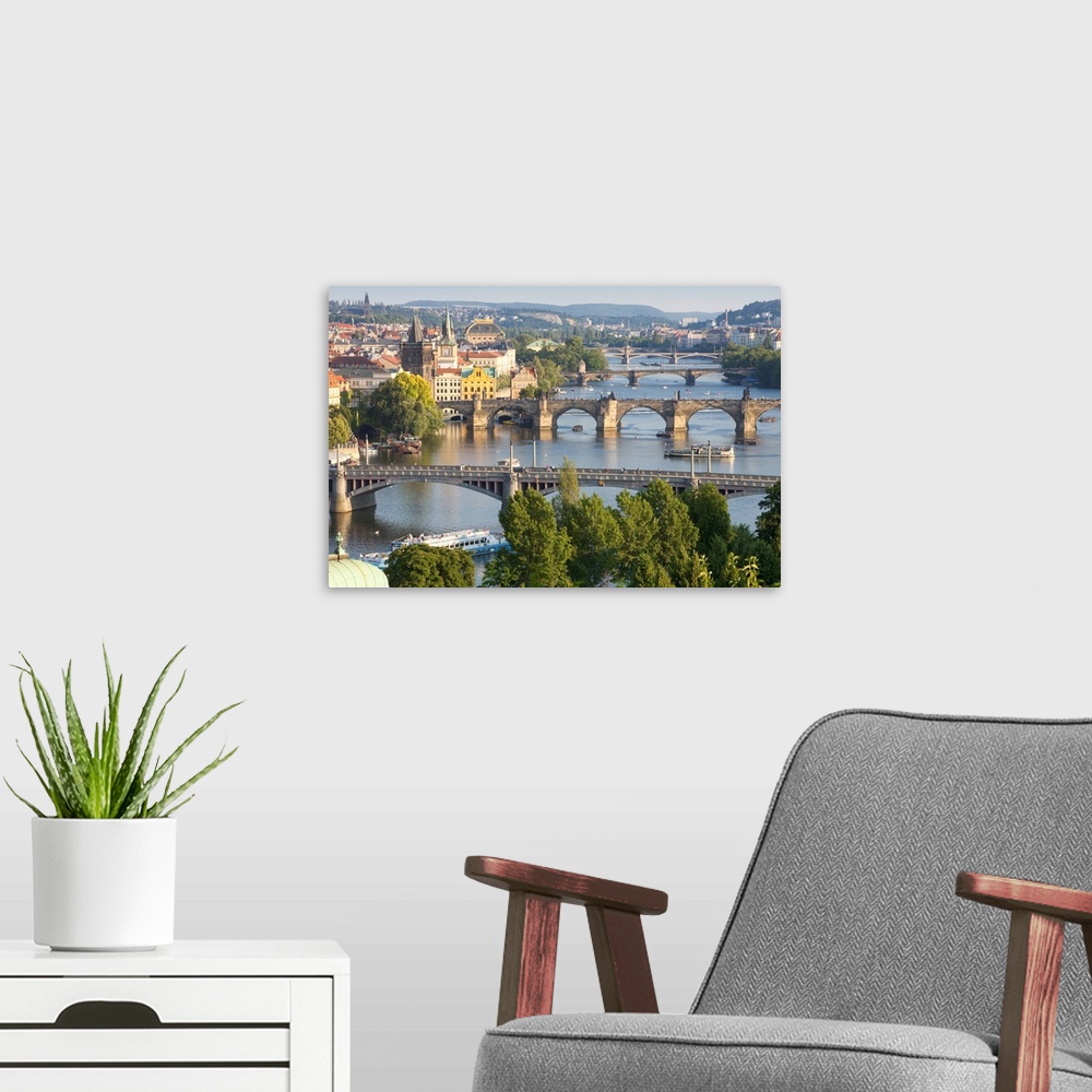 A modern room featuring Czech Republic, Prague, Bridges over Vltava River and Boat Traffic.