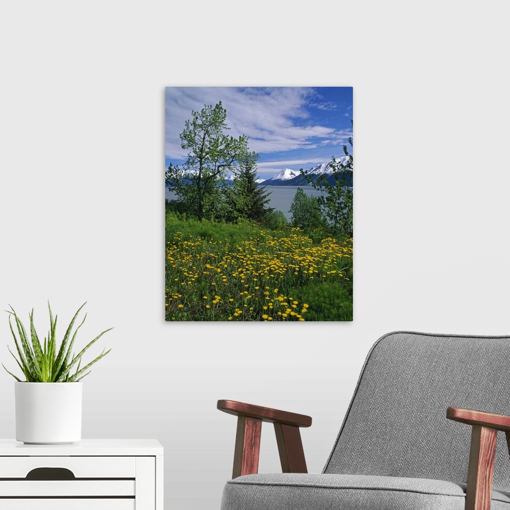 A modern room featuring Big, vertical photograph of trees and a field of dandelion flowers along the shore of Turnagain A...
