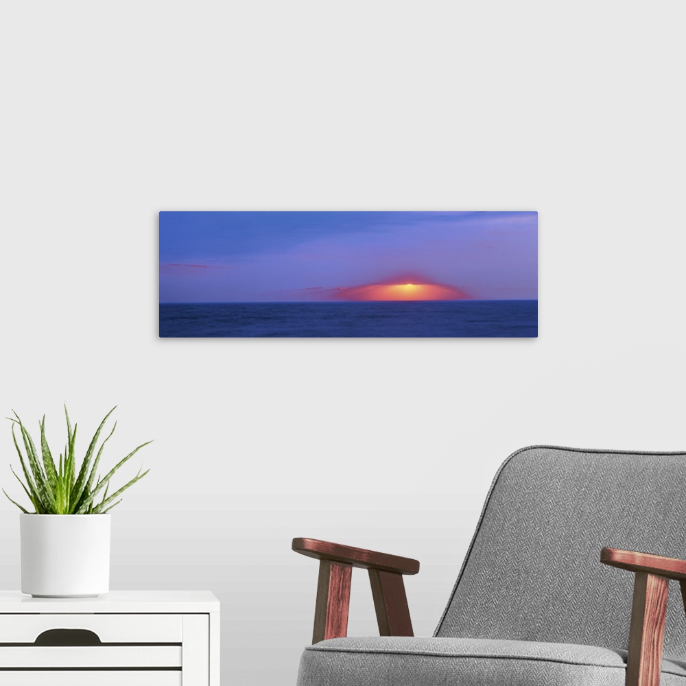 A modern room featuring Dark sunset over Cape May