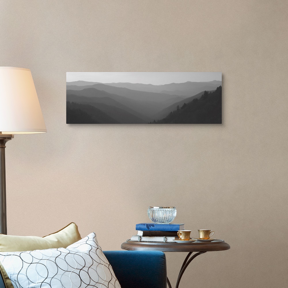 A traditional room featuring Wide angle photograph of a misty mountain landscape as the sun rises over the Great Smoky Mountai...