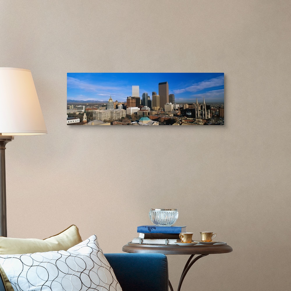 A traditional room featuring Panoramic photo of a downtown cityscape in Colorado against a bright blue sky.