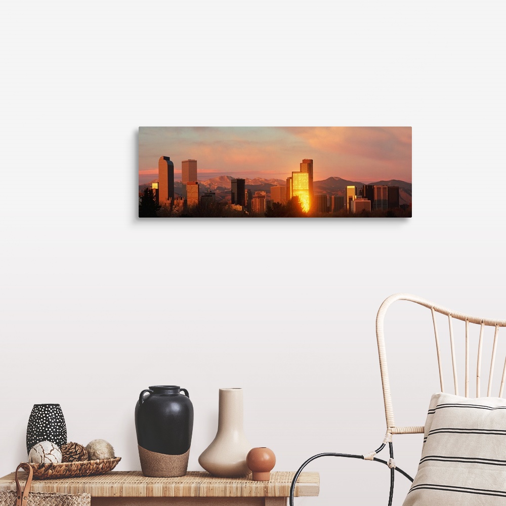 A farmhouse room featuring A panoramic shot taken of the Denver skyline while the sun is setting and reflecting off some of ...