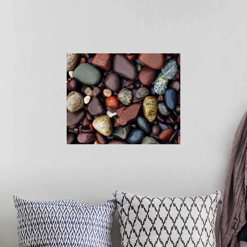 A bohemian room featuring Photograph of collage of rocks varying in color, size, and shape.   Some of the rocks are smoothe...