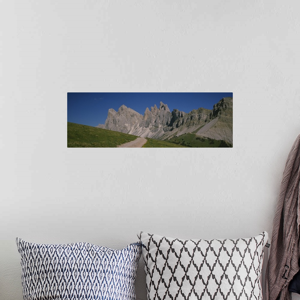 A bohemian room featuring Dirt road leading to a mountain, Geisler Gruppe, Italy