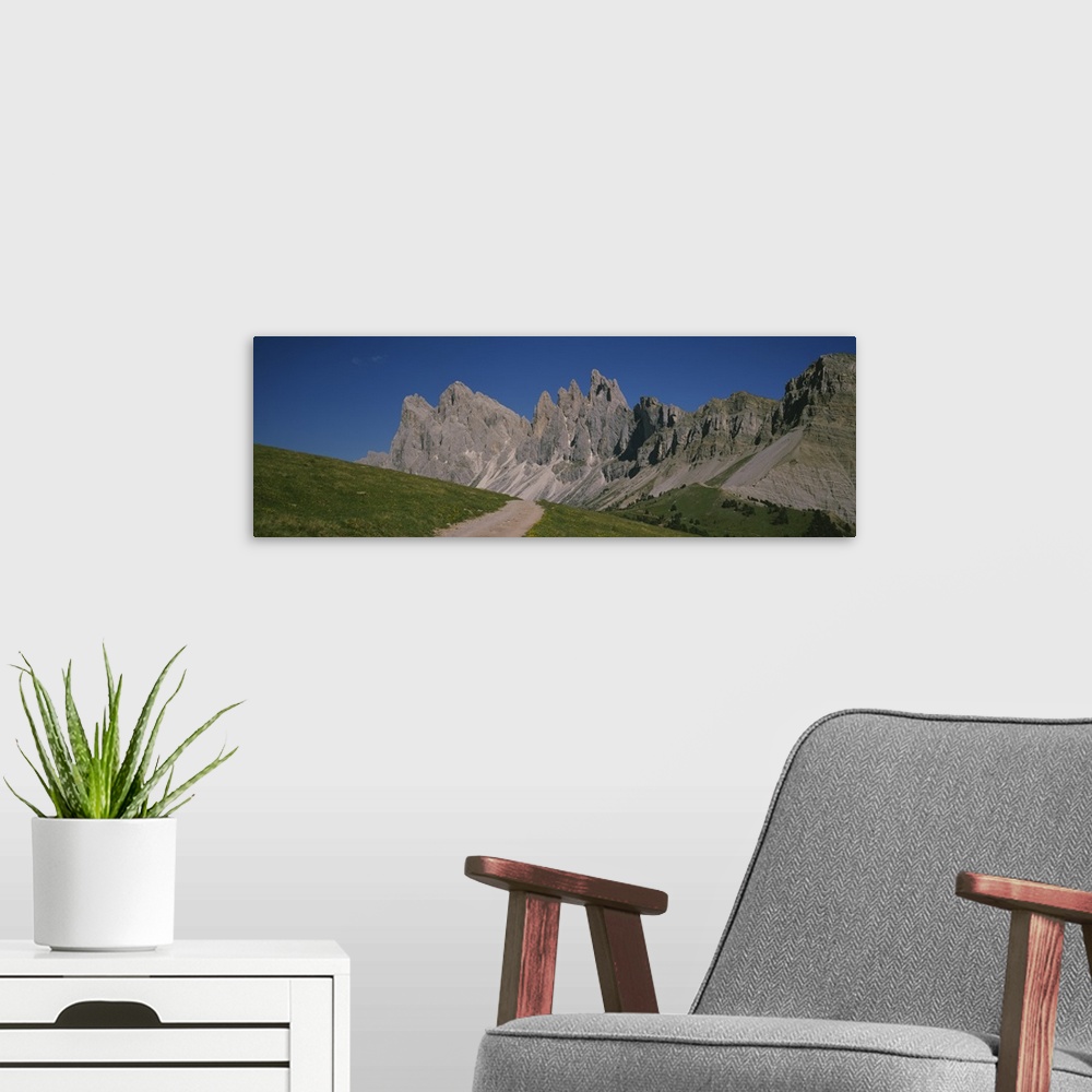 A modern room featuring Dirt road leading to a mountain, Geisler Gruppe, Italy