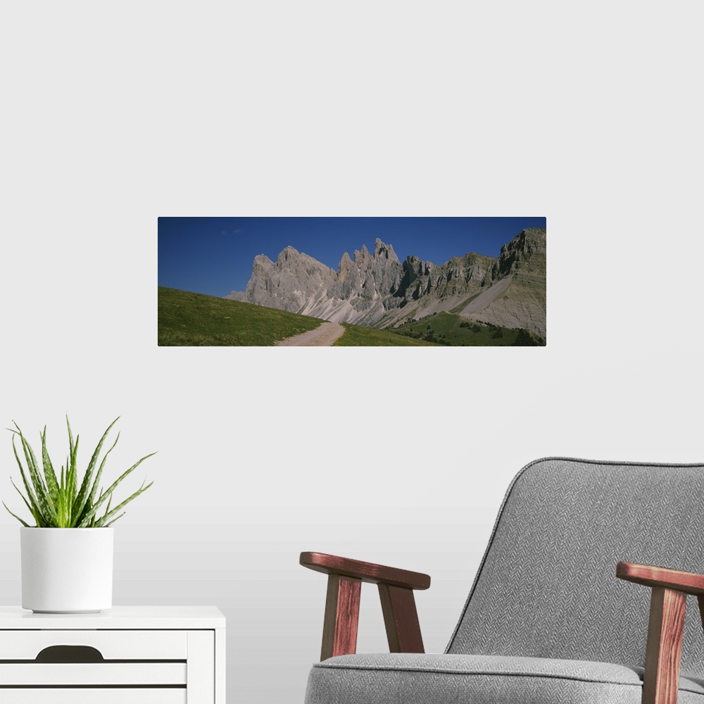 A modern room featuring Dirt road leading to a mountain, Geisler Gruppe, Italy