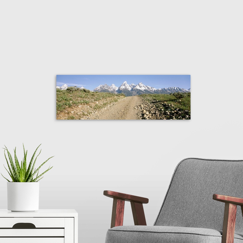 A modern room featuring Dirt road passing through a landscape, Grand Teton National Park, Wyoming