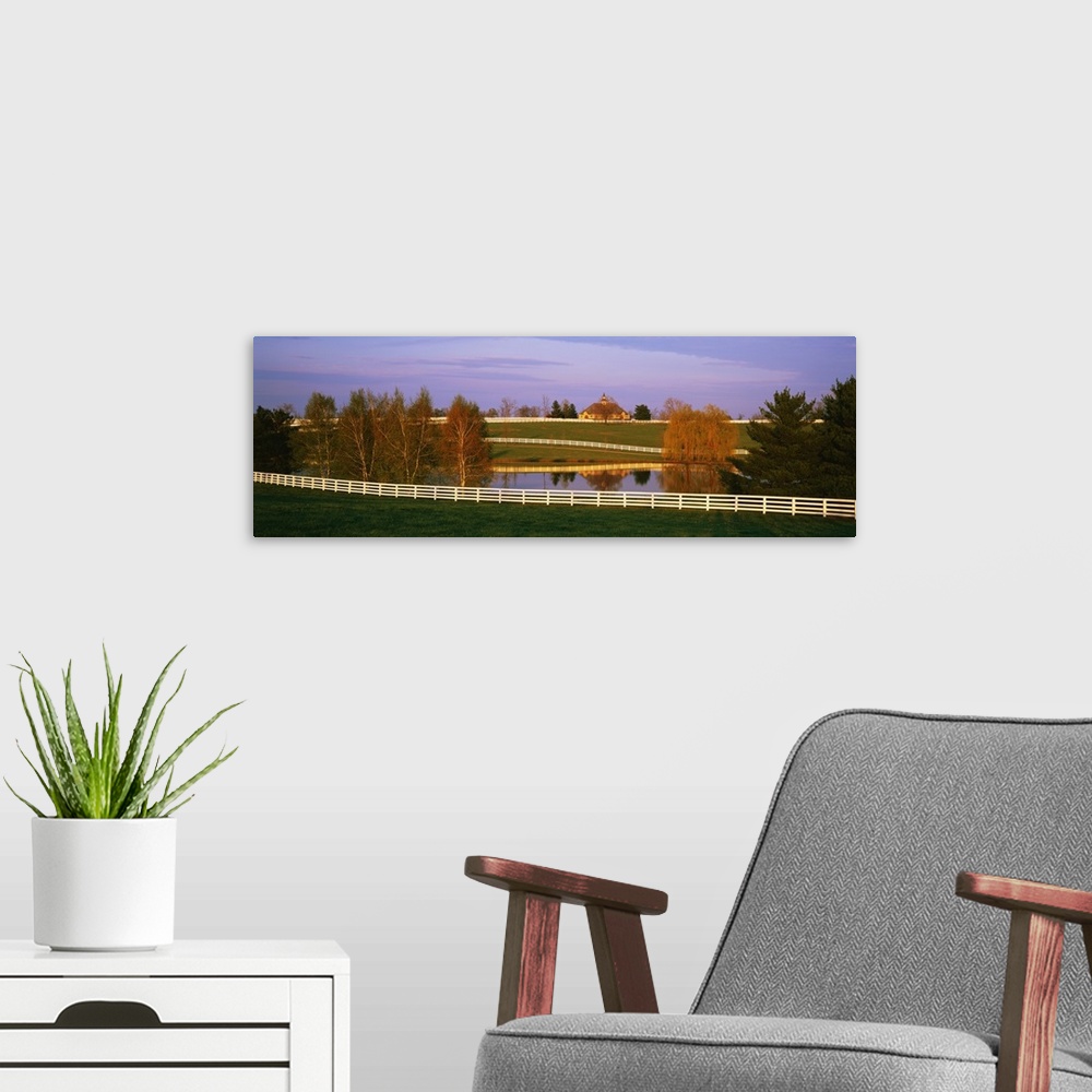 A modern room featuring Panoramic photograph of a horse farm and pond in Kentucky available as wall art for the home or o...