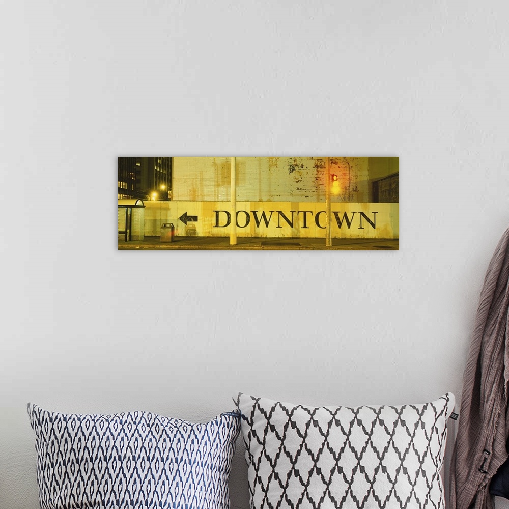 A bohemian room featuring Large panorama of a half wall in downtown San Francisco with a painted sign on it pointing pedest...