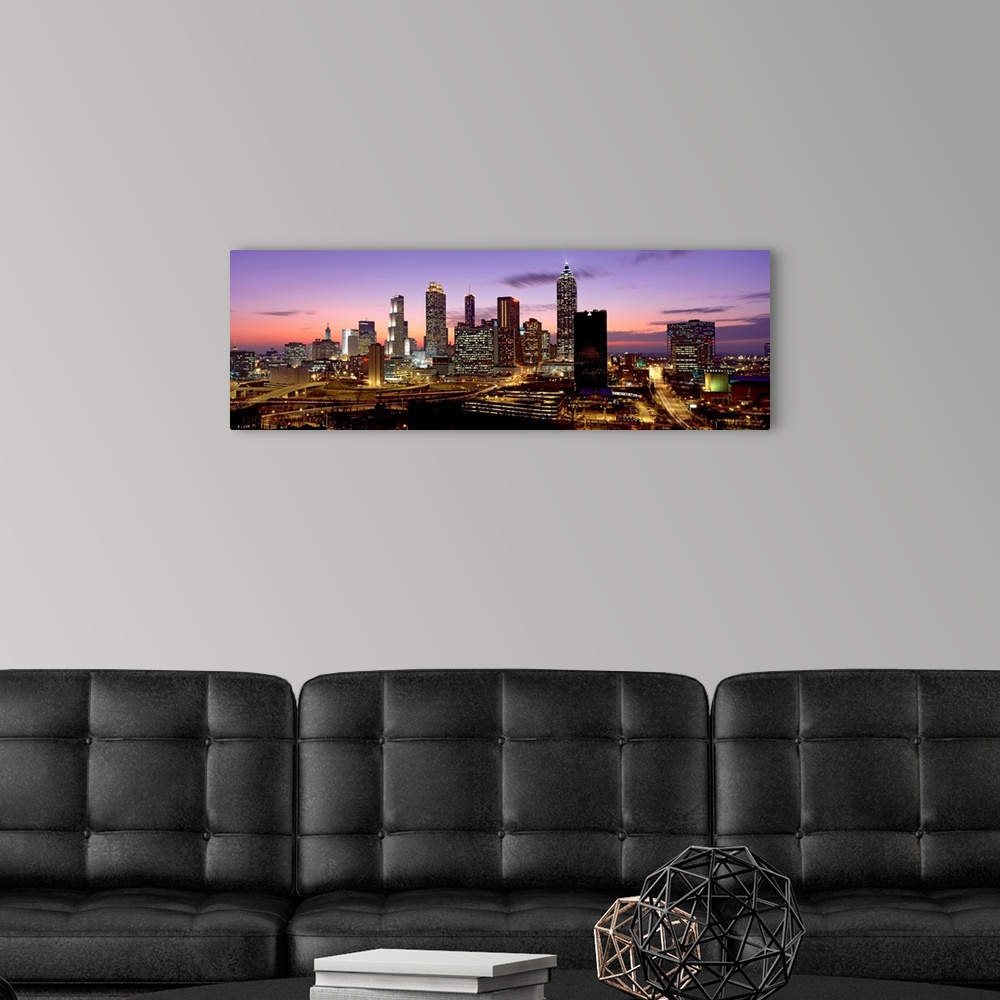 A modern room featuring Panoramic photograph showcasing the busy city streets and large skyscrapers of Atlanta, Georgia t...