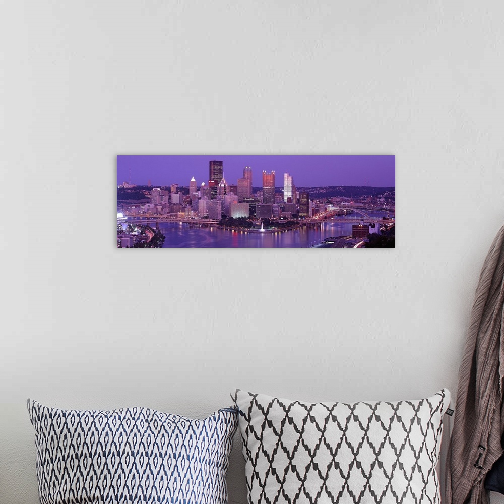 A bohemian room featuring Big, wide angle photograph of Pittsburgh taken at night.