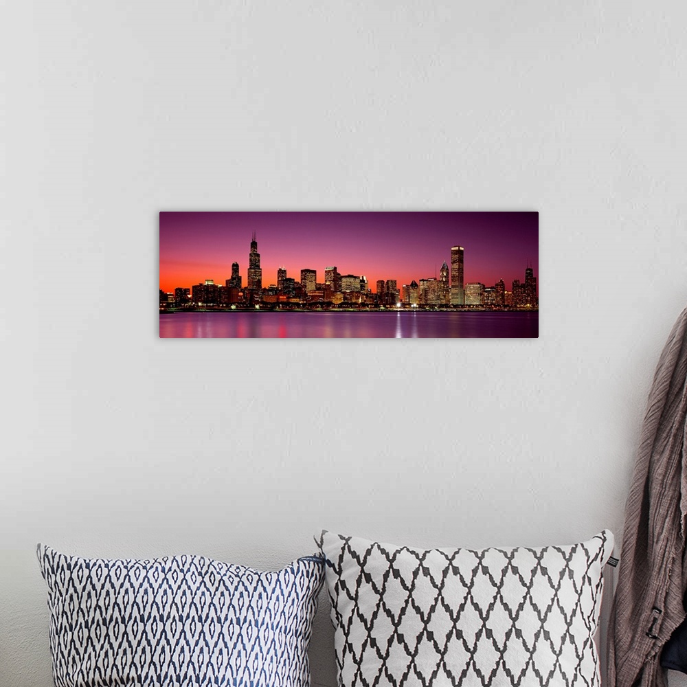 A bohemian room featuring Panoramic photograph of the busy skyline taken at dusk in Chicago, Illinois.  The bright lights c...