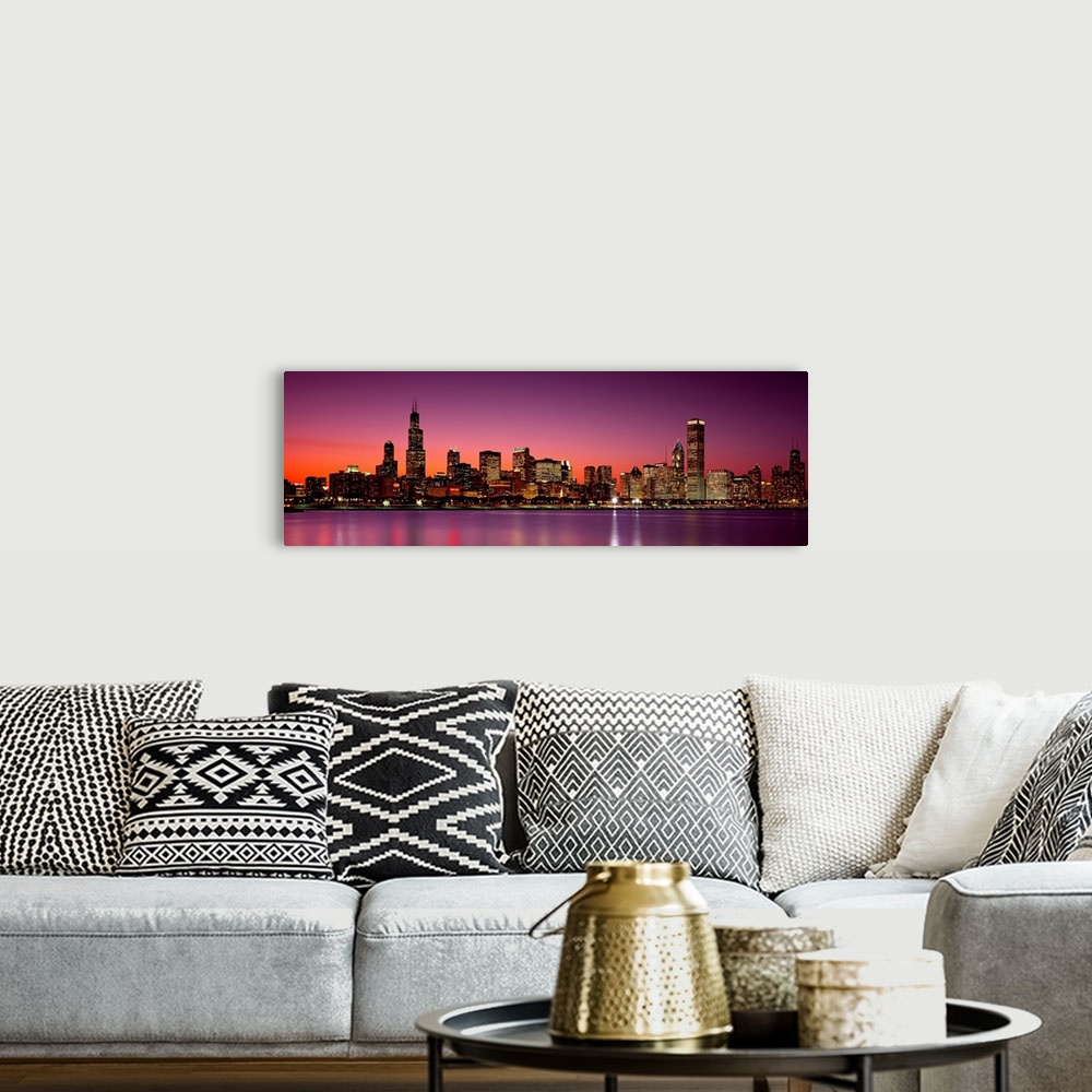 A bohemian room featuring Panoramic photograph of the busy skyline taken at dusk in Chicago, Illinois.  The bright lights c...