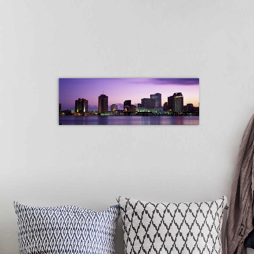 A bohemian room featuring Sunset panorama of the Downtown New Orleans skyline with the Mississippi River in the foreground.