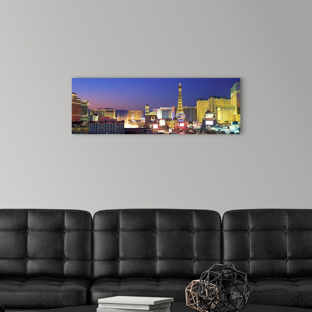 A modern room featuring Panoramic photograph showcasing the bright neon lights of the busy strip in Las Vegas, Nevada at ...