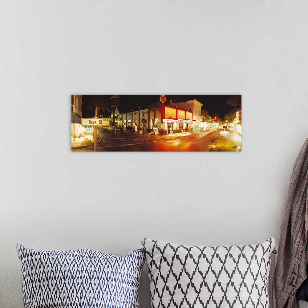 A bohemian room featuring Panoramic photograph taken of a street in Key West during the night with the shops lit up on the ...