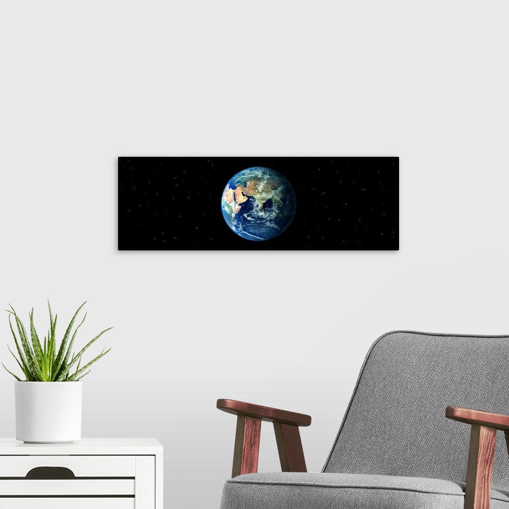 A modern room featuring Earth in Space showing Asia and Africa (Photo Illustration)