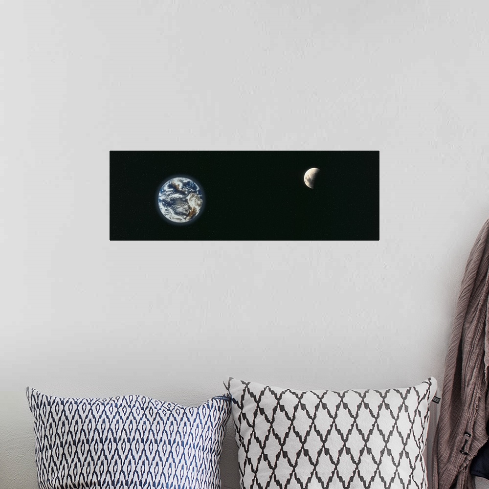 A bohemian room featuring A panoramic re-creation of the earth and a half shaded moon from outer space.