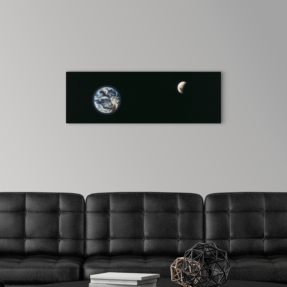 A modern room featuring A panoramic re-creation of the earth and a half shaded moon from outer space.