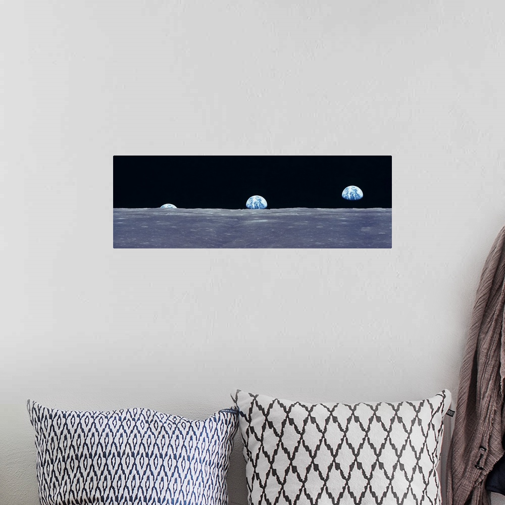 A bohemian room featuring Composite image from the surface of the moon of three photos of the planet Earth rising over the ...