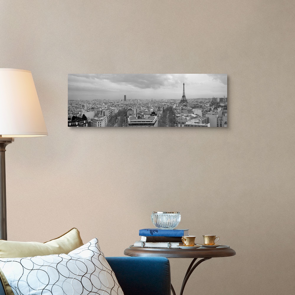 A traditional room featuring An aerial, monochromatic photograph of the city skyline and two large tree lined avenues below in...