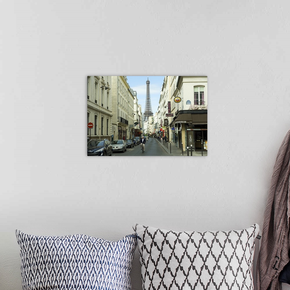 A bohemian room featuring Landscape photograph on an oversized canvas, looking down a street in Paris, full of cars and ped...