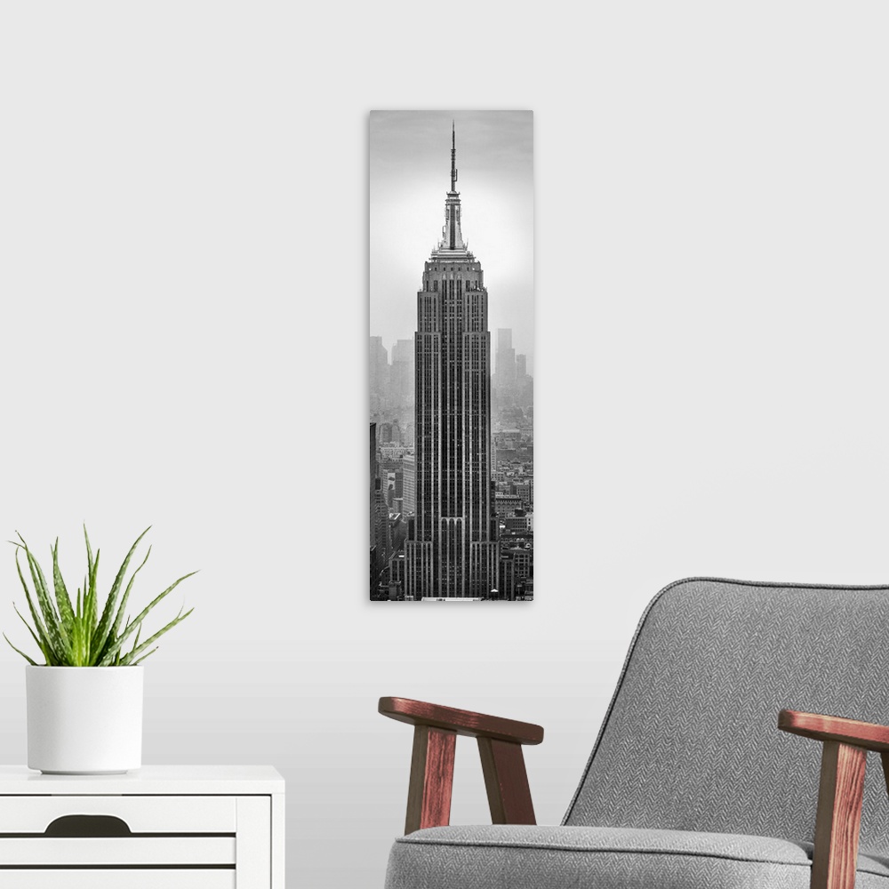 A modern room featuring Empire State Building in a city, Manhattan, New York City, New York State, USA.