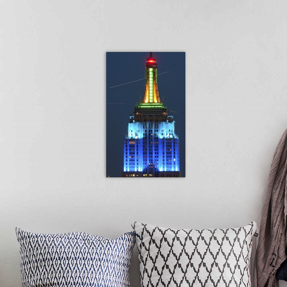 A bohemian room featuring Empire State Building lit up at night, Manhattan, New York City, New York State, USA