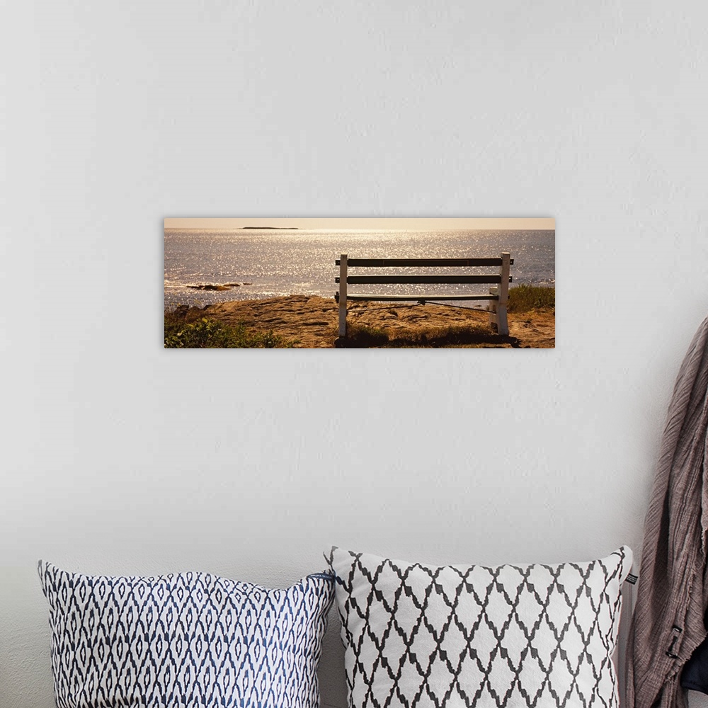A bohemian room featuring Panoramic photo on canvas of an empty bench overlooking a beach in the northeast US.