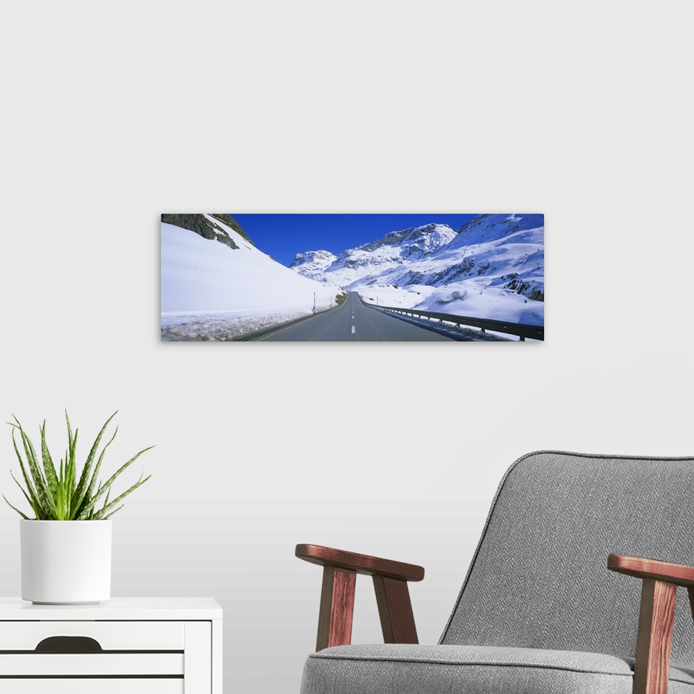 A modern room featuring Empty road passing through a polar landscape, Route 3, Graubunden, Switzerland