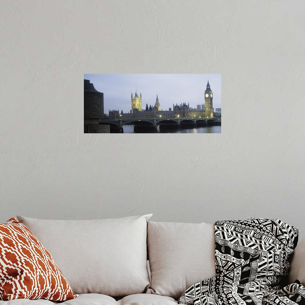 A bohemian room featuring This photograph is taken of parliament and the big ben clock tower in London during dusk.