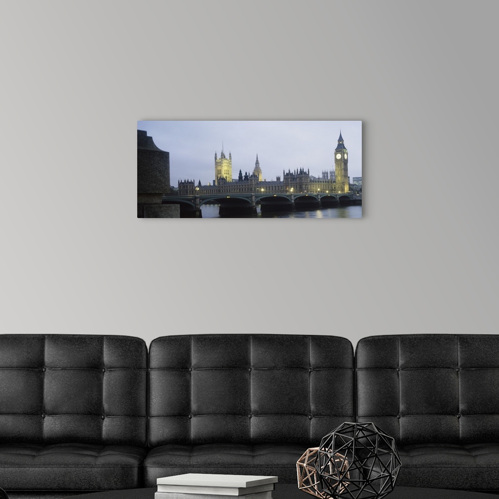 A modern room featuring This photograph is taken of parliament and the big ben clock tower in London during dusk.