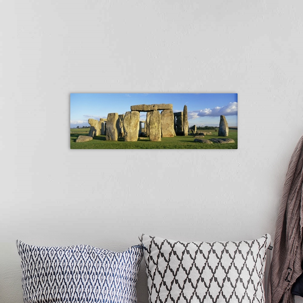 A bohemian room featuring A detailed panoramic view of the famous prehistoric monument, Stonehenge, located in England.
