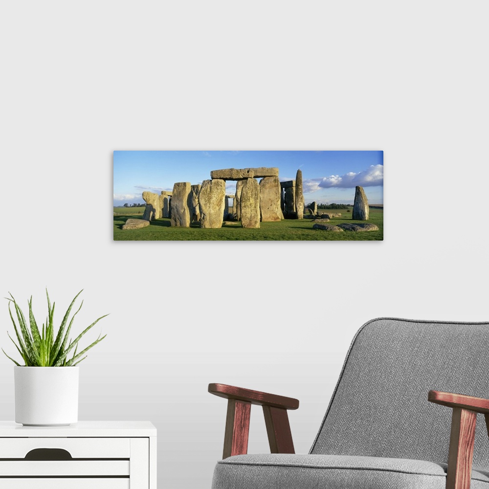 A modern room featuring A detailed panoramic view of the famous prehistoric monument, Stonehenge, located in England.