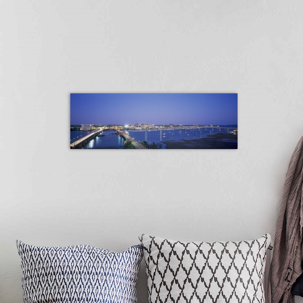 A bohemian room featuring Panoramic photograph on a big canvas of two bridges over water, leading toward the brightly lit C...