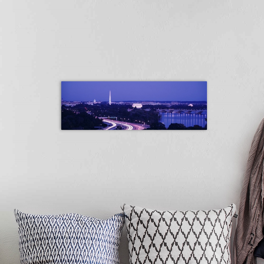 A bohemian room featuring Wide angle view of the nations capital during dusk with the monuments lit up and the highway illu...