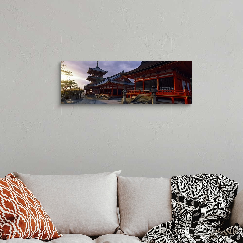 A bohemian room featuring Panoramic photograph on a giant canvas of the Kiyomizu-Dera Temple, shadowed as the sun sets in t...