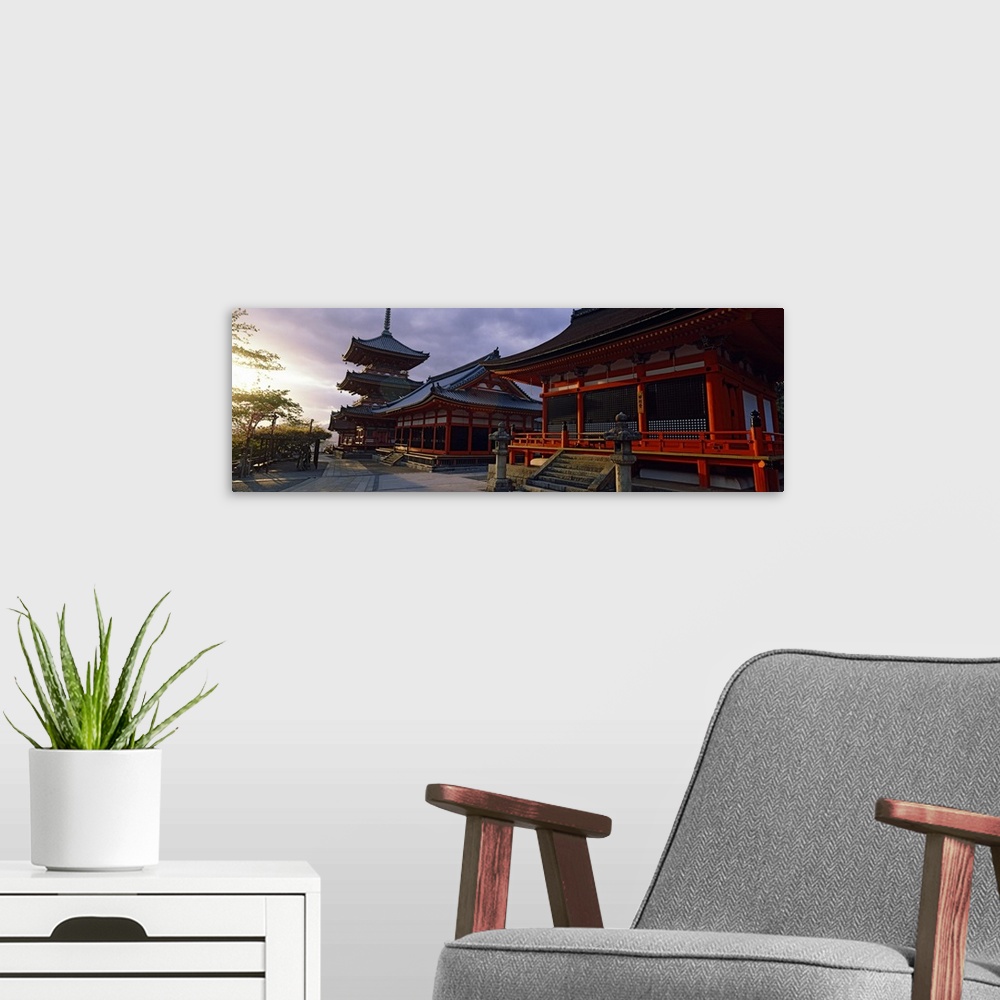 A modern room featuring Panoramic photograph on a giant canvas of the Kiyomizu-Dera Temple, shadowed as the sun sets in t...
