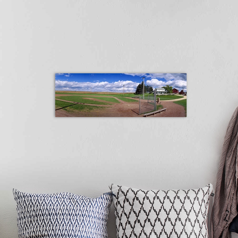 A bohemian room featuring Landscape, large photograph of a baseball diamond on a farm, beneath a vast blue sky in Dyersvill...