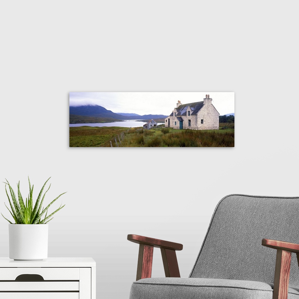 A modern room featuring Farm house on bluff, mountains in mist, Isle of Lewis, Scotland